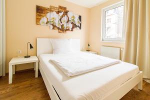 Posteľ alebo postele v izbe v ubytovaní Residenz Donaucity