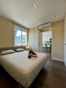 a large bed in a bedroom with a large window at El Horizonte de Benicassim II, Descubre esta lujosa propiedad a los pies del Mediterraneo in Benicàssim +34 photos