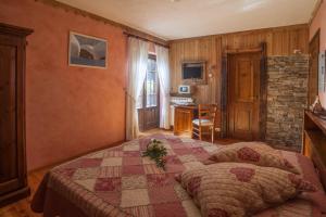 Postel nebo postele na pokoji v ubytování Albergo Boule de Neige