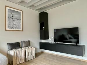TV a/nebo společenská místnost v ubytování Vitamin Sea