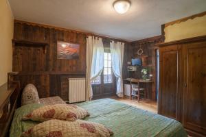 Postel nebo postele na pokoji v ubytování Albergo Boule de Neige