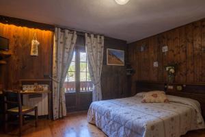 Postel nebo postele na pokoji v ubytování Albergo Boule de Neige