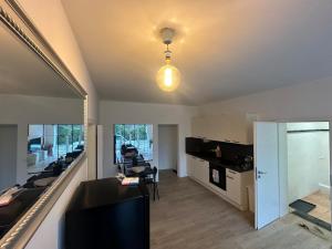 A television and/or entertainment centre at Renovated in style - Close to Hamburg