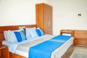 Postel nebo postele na pokoji v ubytování Flaming Tree Resorts