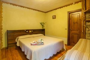 Postel nebo postele na pokoji v ubytování Albergo Boule de Neige