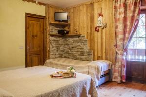 Postel nebo postele na pokoji v ubytování Albergo Boule de Neige
