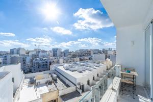 a view of a city from the roof of a building at Bright and modern apartment in St Julian's
