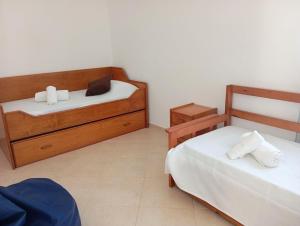 2 camas en una habitación con 2 camas sidx sidx sidx sidx sidx sidx sidx sidx sidx sidx en Villa Cacela Mar, en Vila Nova de Cacela