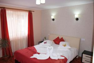 Postel nebo postele na pokoji v ubytování Anduțu