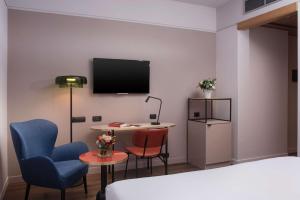 A television and/or entertainment centre at NH Catania Centro