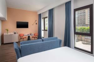 A television and/or entertainment centre at NH Catania Centro