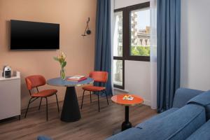 A television and/or entertainment centre at NH Catania Centro