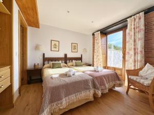 a bedroom with a large bed and a window at La Casita Azul - 1004 in Arnuero
