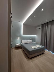 Postel nebo postele na pokoji v ubytování City Center Residence