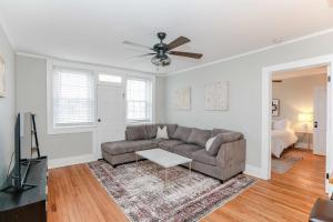 a living room with a couch and a ceiling fan at Sojourn at Colley Manor Unit 5 Sleeps 4 in Norfolk