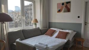 En eller flere senge i et værelse på Olive Garden City Center + 30 billeder