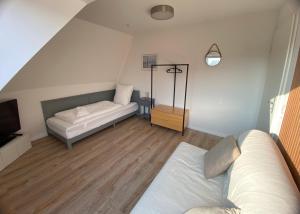 Postel nebo postele na pokoji v ubytování Ferienwohnung Lütje Vogelsang