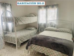 Letto o letti in una camera di Manantial Village