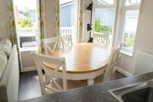 a dining room table and chairs in a kitchen at Croyde Bay Hotel or Self Catering in Croyde