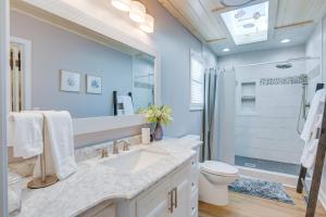 a bathroom with a sink and a toilet and a shower at Radford Home with Wraparound Deck! in Radford +21 photos