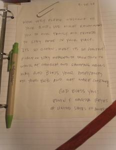 a notebook with a pen and aritten letter at B&B Stupor Mundi in Altamura
