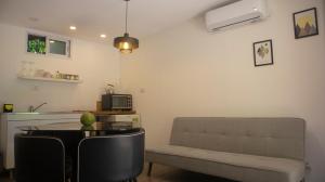 a living room with a couch and a table at Cabañas Aire Fresco in Mar del Plata