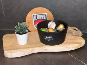 a cactus and a container on a cutting board at Cime de Caron - Appartement cosy refait à neuf 4 personnes - Valthosun - Val Thorens in Val Thorens +11 photos