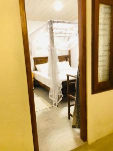 Ένα ή περισσότερα κρεβάτια σε δωμάτιο στο Tropical Room light