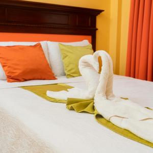 Postel nebo postele na pokoji v ubytování Hotel Las Hamacas
