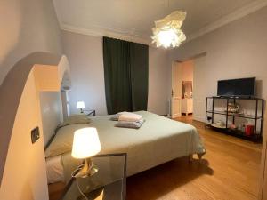 Postel nebo postele na pokoji v ubytování Paradise Rooms - Brignole Station