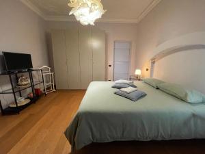 Postel nebo postele na pokoji v ubytování Paradise Rooms - Brignole Station