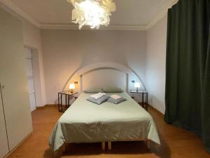Postel nebo postele na pokoji v ubytování Paradise Rooms - Brignole Station