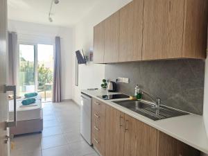 Kuchyň nebo kuchyňský kout v ubytování Piazza Napa Suites