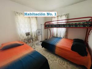 Letto o letti in una camera di Manantial Village