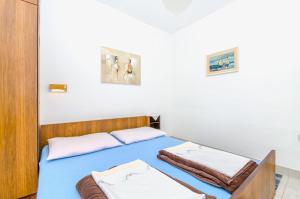 Postel nebo postele na pokoji v ubytování Apartmani Smiljana