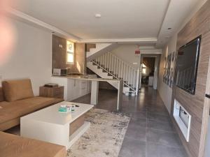 a living room with a couch and a table at فلل السيف الخاصة in Abha