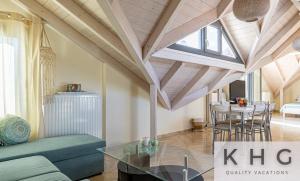 a living room with a couch and a table at Zoi's Sea View Apartments in Lixouri in Lixouri