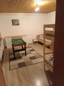 a room with a pool table and a bunk bed at Geräumige Ferienwohnung 90 sqm im Erholungsort in Bestwig