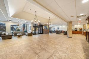 a large lobby with couches and chairs in a building at Black Bear Inn & Suites in Gatlinburg +15 photos