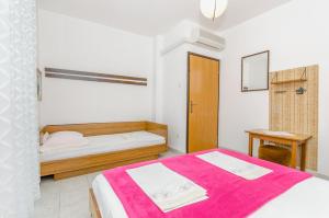Postel nebo postele na pokoji v ubytování Apartmani Smiljana