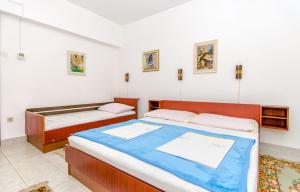 Postel nebo postele na pokoji v ubytování Apartmani Smiljana