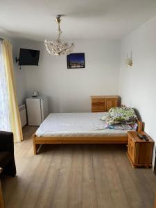 Postel nebo postele na pokoji v ubytování Nad Stawem I i II