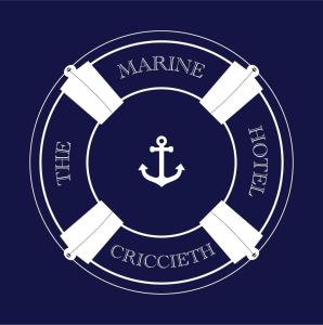a white insignia with an anchor on a blue background at The Marine Hotel in Criccieth +1 photo