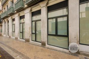 a row of windows on the side of a building at Dulce descanso para 10, ven a Duque de Rivas 8 E3 in Madrid