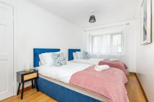 a bedroom with two beds and a window at Contractor & Business Stays Birchwood Bus Park in Risley