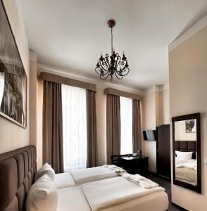 Postel nebo postele na pokoji v ubytování Upper Room Hotel Kurfürstendamm