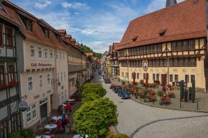 an empty street in a town with buildings at Stolberger Hof in Stolberg i. Harz
