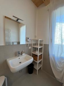a bathroom with a sink and a mirror at Residence Duomo in Castelfranco Veneto
