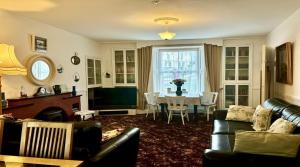 a living room with a couch and a table at White Heather 3 Bed Clifden Town in Clifden