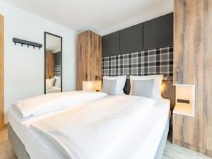 Ένα ή περισσότερα κρεβάτια σε δωμάτιο στο Tauernlodge Eben D1